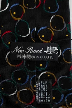 Unlabeled silk black tie with multi-color circle pattern