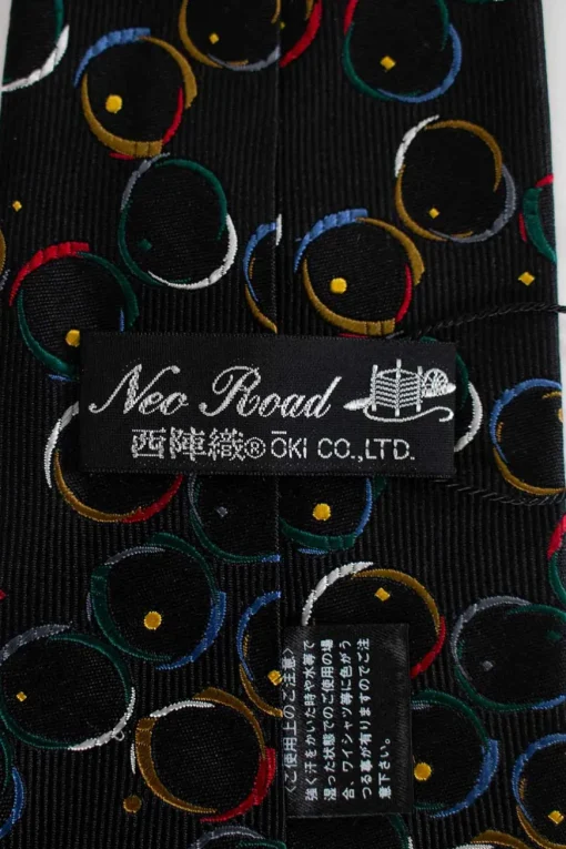 Unlabeled silk black tie with multi-color circle pattern