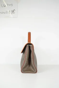 Vintage Fendi print canvas top handle bag with camel leather trimmings. Flap with turn lock fastening. Two main compartments lined in leather, one with zip pocket. Removable shoulder strap