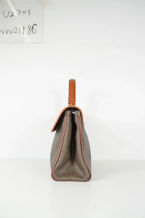 Vintage Fendi print canvas top handle bag with camel leather trimmings. Flap with turn lock fastening. Two main compartments lined in leather, one with zip pocket. Removable shoulder strap