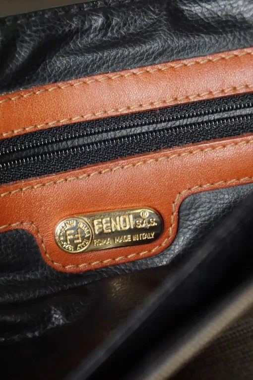 Vintage Fendi print canvas top handle bag with camel leather trimmings. Flap with turn lock fastening. Two main compartments lined in leather, one with zip pocket. Removable shoulder strap
