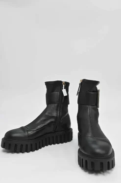 Viv' go-thick black leather platform ankle boots with oversized buckles