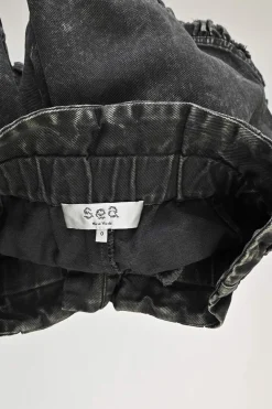 Washed black cotton denim paperbag waist pull-on shorts with frill-trimmed hems