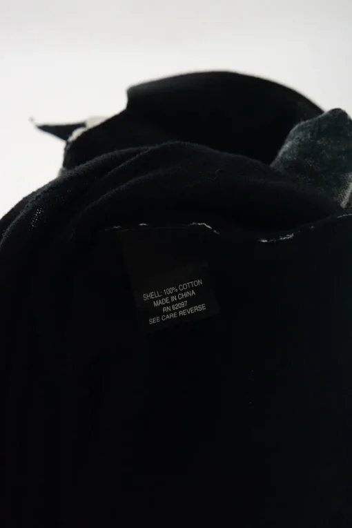 Washed black cotton polo top with contrasting collar, cuffs, and hem
