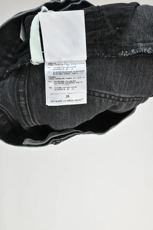 Washed black raw edge cotton denim high-rise shorts with whiskering details