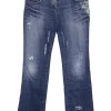 Washed indigo cotton denim low-rise bootcut jeans with whiskering details at hip level
