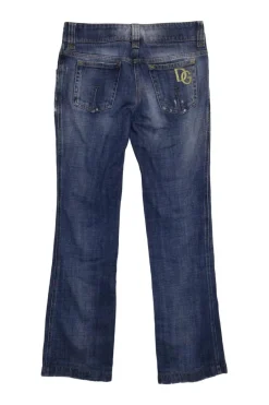 Washed indigo cotton denim low-rise bootcut jeans with whiskering details at hip level