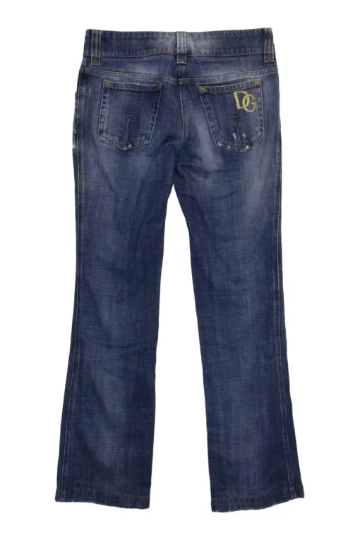 Washed indigo cotton denim low-rise bootcut jeans with whiskering details at hip level