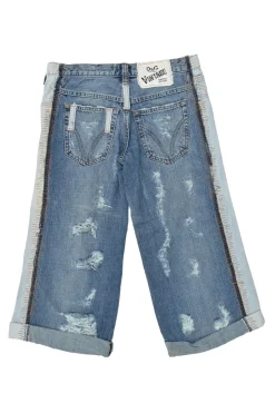 Washed indigo cotton denim low-rise distressed capri pants with rolled-up cuffs