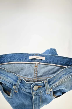 Washed indigo cotton denim pull-on high-rise straight-leg jeans with contrast patch appliqué