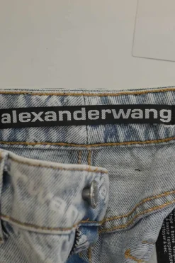 Washed indigo cotton denim pull-on high-rise war-edge logo print shorts