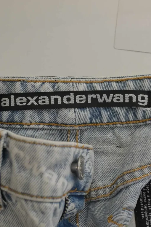 Washed indigo cotton denim pull-on high-rise war-edge logo print shorts