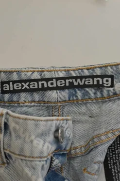 Washed indigo cotton denim pull-on high-rise war-edge logo print shorts