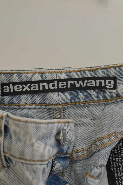 Washed indigo cotton denim pull-on high-rise war-edge logo print shorts