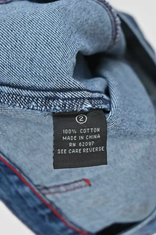 Washed indigo cotton denim denim jacket and low-rise bootcut jeans featuring dragon broderie motif