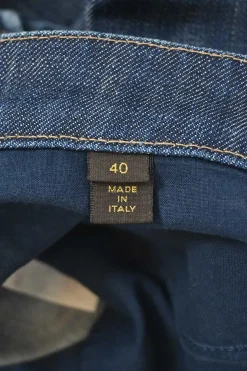 Washed indigo denim low-rise zip-ankle bow leg stove pipe jeans with rear cargo pockets