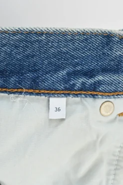 Washed indigo denim pull-on high-rise straight leg jeans with anagram knee motif
