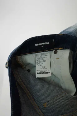Washed indigo distressed cotton-blend denim low-rise paint splattered Pat skinny jeans with turn up cuffs