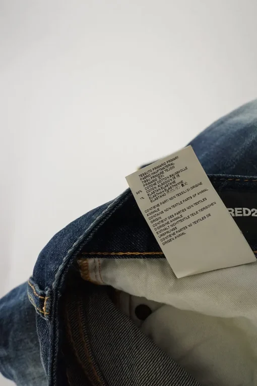 Washed indigo distressed cotton-blend denim low-rise paint splattered Pat skinny jeans with turn up cuffs