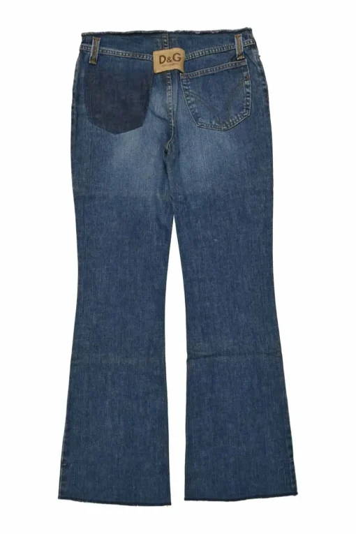 Washed indigo raw edge cotton denim pull-on low-rise flared jeans