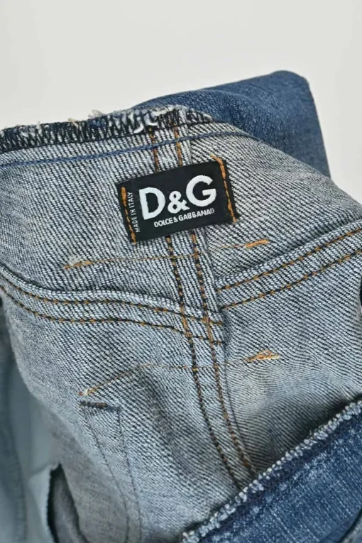 Washed indigo raw edge cotton denim pull-on low-rise flared jeans