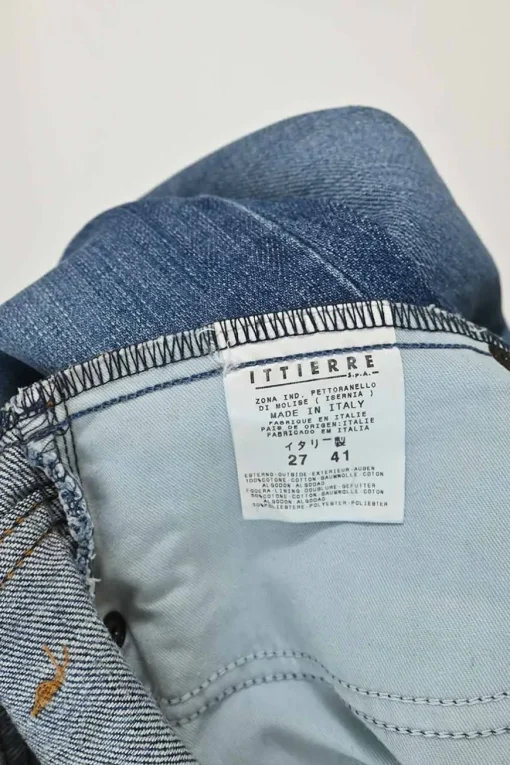 Washed indigo raw edge cotton denim pull-on low-rise flared jeans