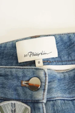 Washed patch-embellished indigo cotton-blend denim low-rise skinny cuffed jeans