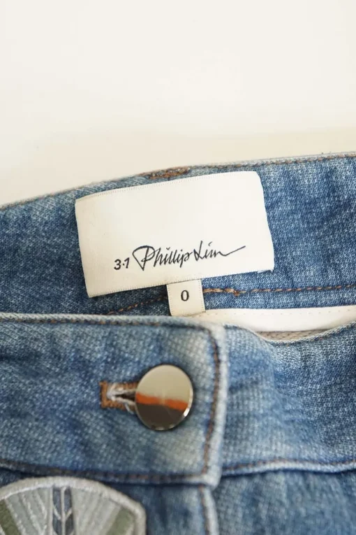 Washed patch-embellished indigo cotton-blend denim low-rise skinny cuffed jeans
