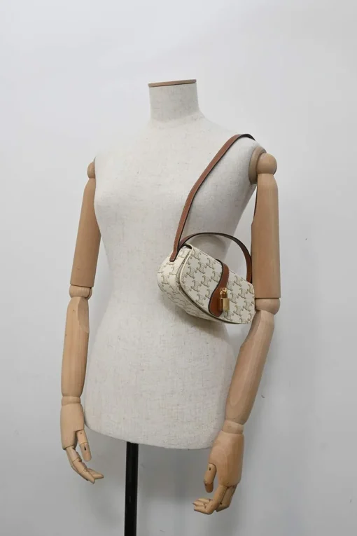 White coated Triomphe monogram canvas and calfskin Tabou clutch on strap