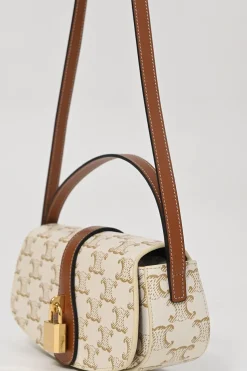 White coated Triomphe monogram canvas and calfskin Tabou clutch on strap