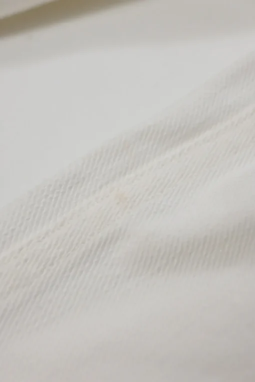 White cotton low-rise wide-leg jeans with split logo waistband