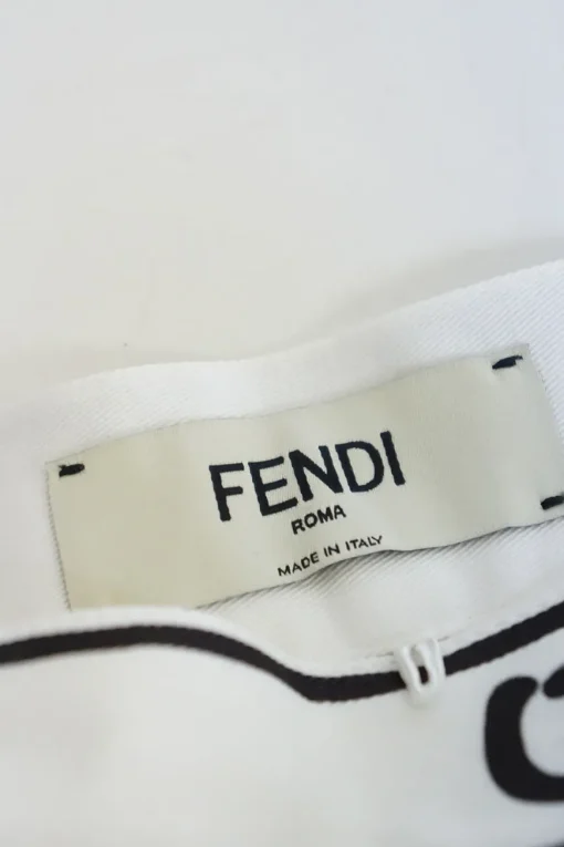 White cotton trompe l'oeil mini skirt with graphic sketched details and two back patch pockets