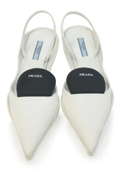 White fabric and rubber pointed-toe slingback court pumps with contrasting logo tongue
