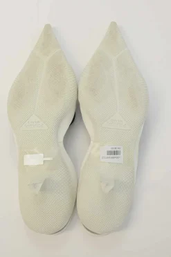 White fabric and rubber pointed-toe slingback court pumps with contrasting logo tongue