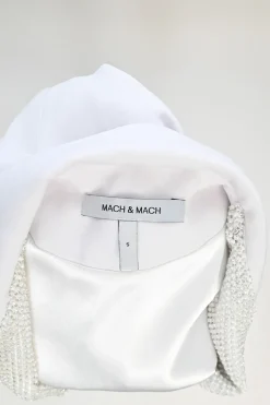 White feather-trimmed peak lapel tuxedo jacket with crystal-embellished lapels and pockets