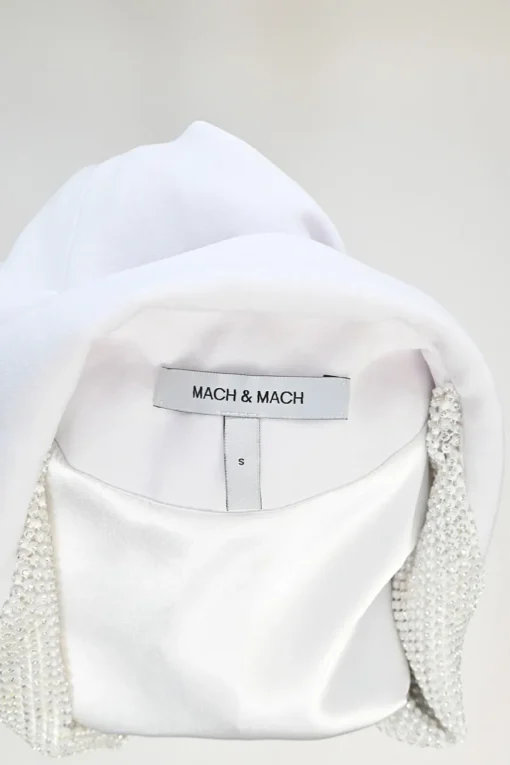 White feather-trimmed peak lapel tuxedo jacket with crystal-embellished lapels and pockets