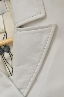 White lambskin single breasted notch lapel tailored jacket with Coco Mark shank buttons