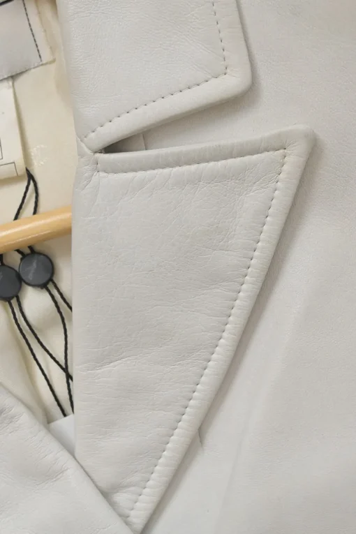 White lambskin single breasted notch lapel tailored jacket with Coco Mark shank buttons