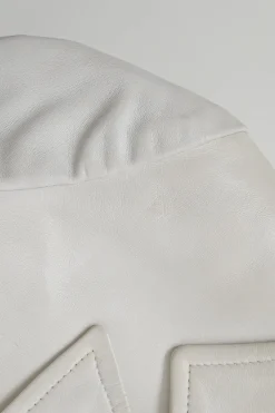 White lambskin single breasted notch lapel tailored jacket with Coco Mark shank buttons
