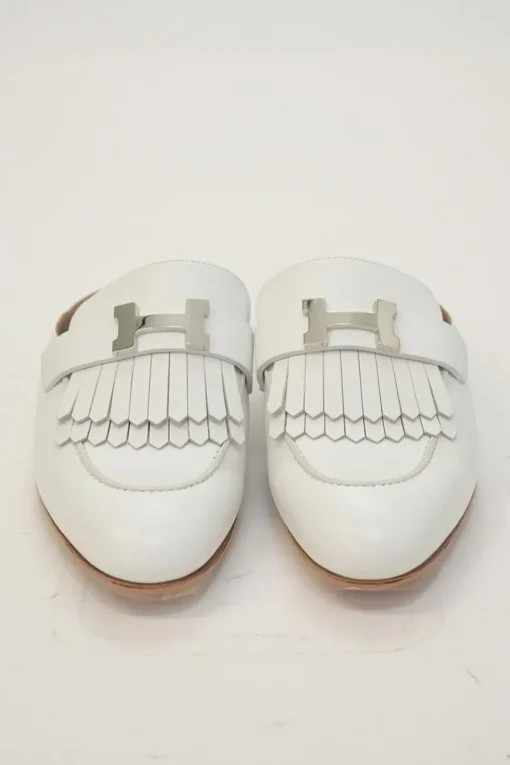 White leather Rivoli slip-on mules featuring palladium-plated H vamp buckle appliqué