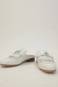 White leather Rivoli slip-on mules featuring palladium-plated H vamp buckle appliqué