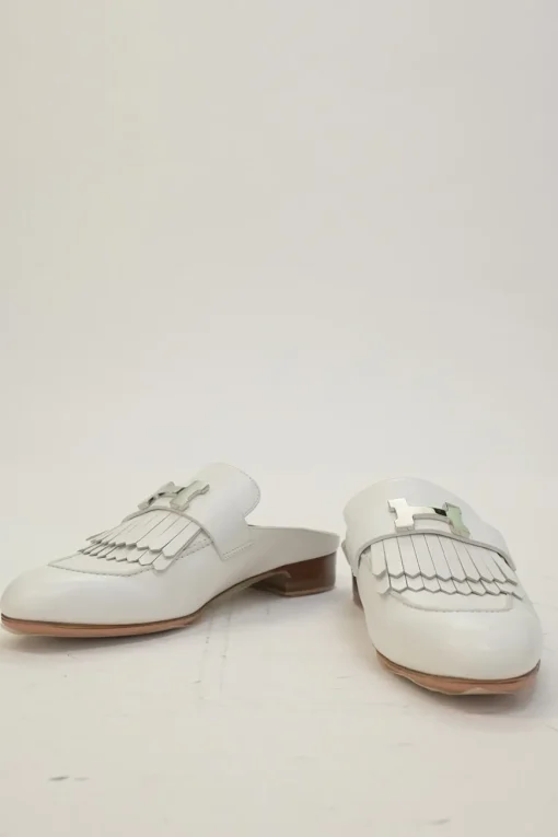 White leather Rivoli slip-on mules featuring palladium-plated H vamp buckle appliqué