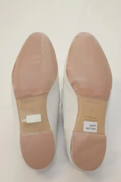 White leather Rivoli slip-on mules featuring palladium-plated H vamp buckle appliqué