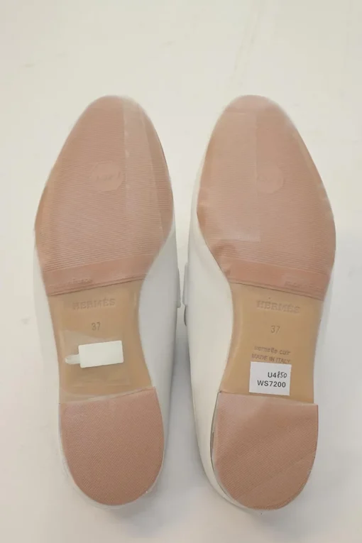 White leather Rivoli slip-on mules featuring palladium-plated H vamp buckle appliqué