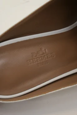 White leather Rivoli slip-on mules featuring palladium-plated H vamp buckle appliqué