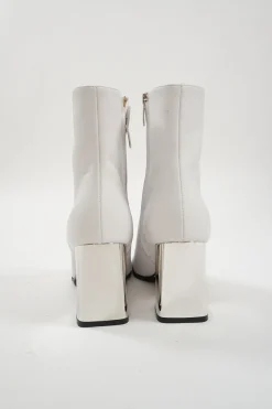 White leather square-toe zip-up ankle booties with mirrored block heel