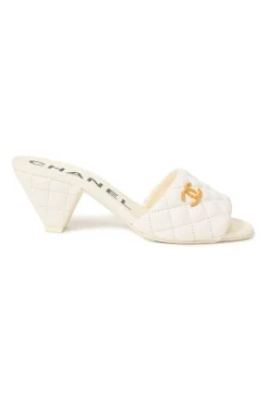 White matelassé goatskin leather and rubber cone heel slide sandals with gold-finish Coco Mark vamp appliqué