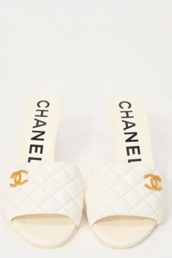 White matelassé goatskin leather and rubber cone heel slide sandals with gold-finish Coco Mark vamp appliqué