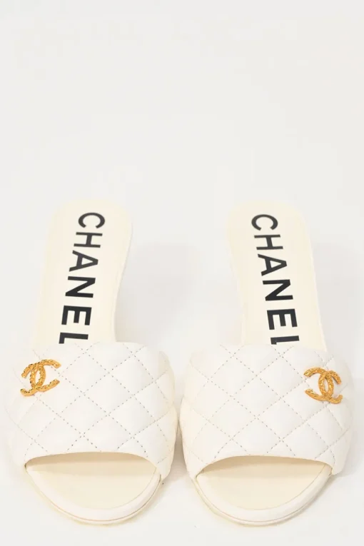 White matelassé goatskin leather and rubber cone heel slide sandals with gold-finish Coco Mark vamp appliqué