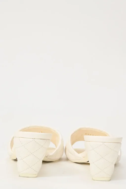 White matelassé goatskin leather and rubber cone heel slide sandals with gold-finish Coco Mark vamp appliqué